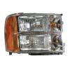 GMC Sierra pickup front headlight lens assembly with housing